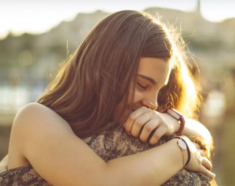 youth hugging outside | Covenant House - Donate Now