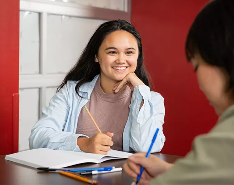 former homeless girls engaged in schoolwork | Covenant House