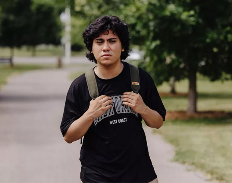 Homeless teen with backpack