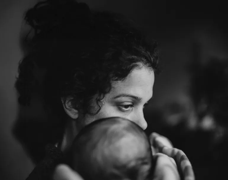 Homeless young mother holding baby | Covenant House - Donate today to help youth in need