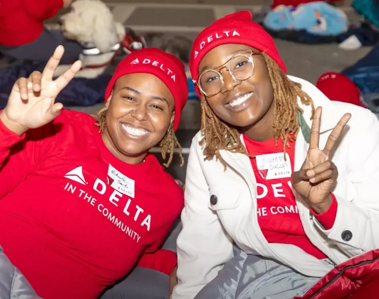 Delta staff posing for picture during Sleep Out | Covenant House - Corporate Partnerships