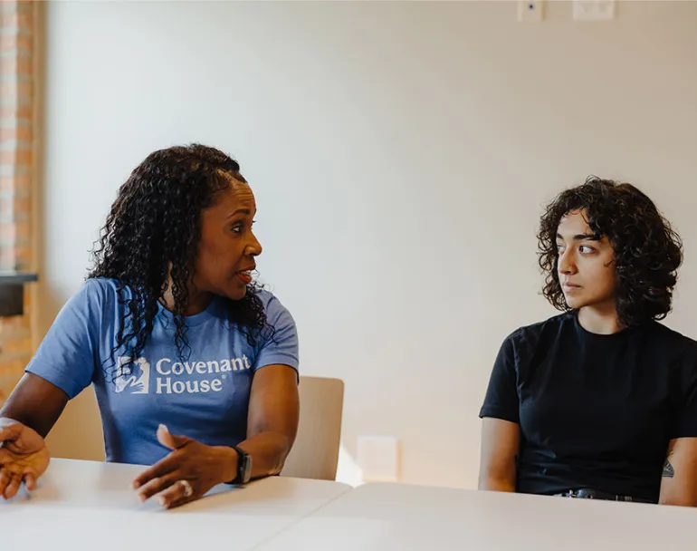 Covenant House homeless youth with staff in the middle of a conversation