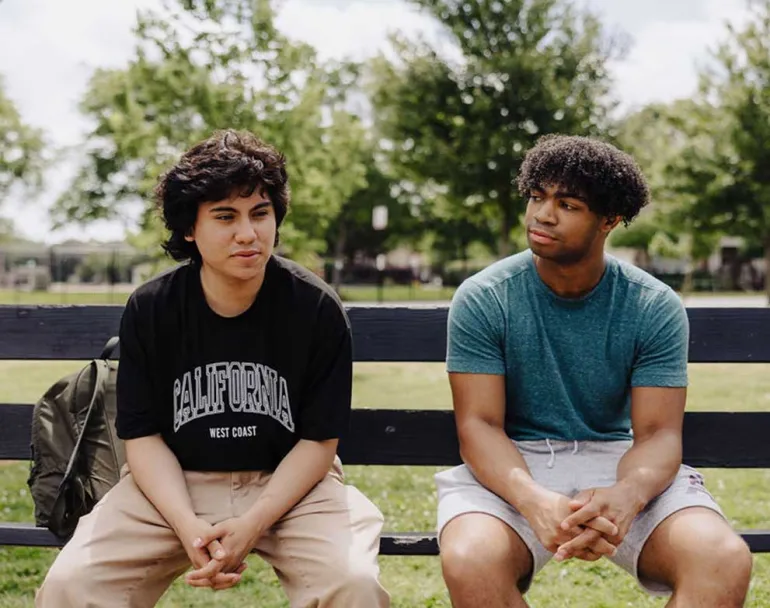 homeless boys sitting on a bench | Covenant House Oakland