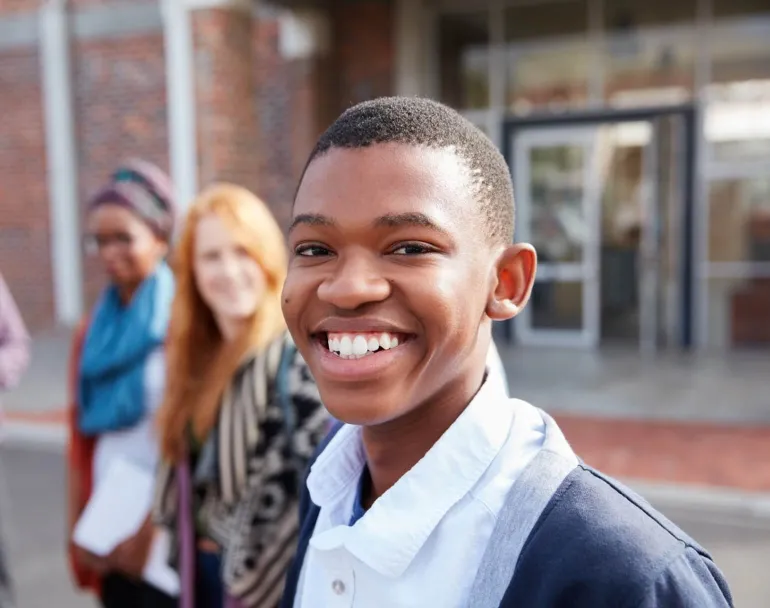Covenant House Be An Angel Day | group of former homeless youth smiling