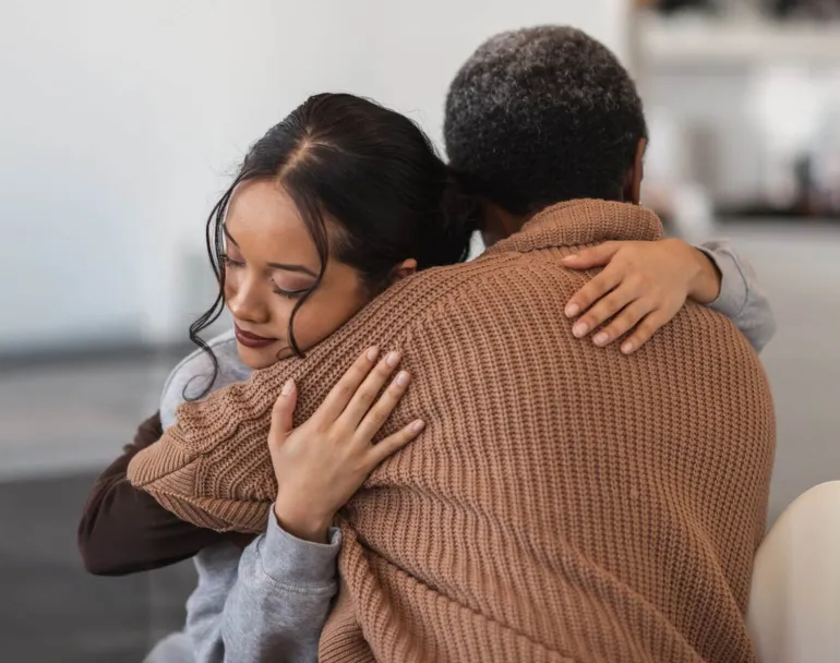 former homeless youth giving each other a hug | Covenant House - Be an Angel Day