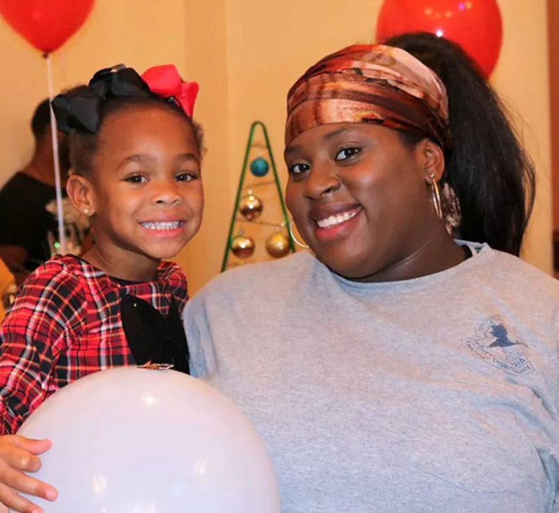 Covenant House mother and daughter at party