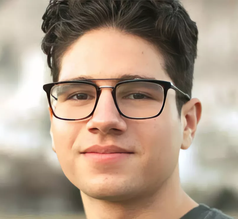 Homeless teen wearing glasses looking into the camera