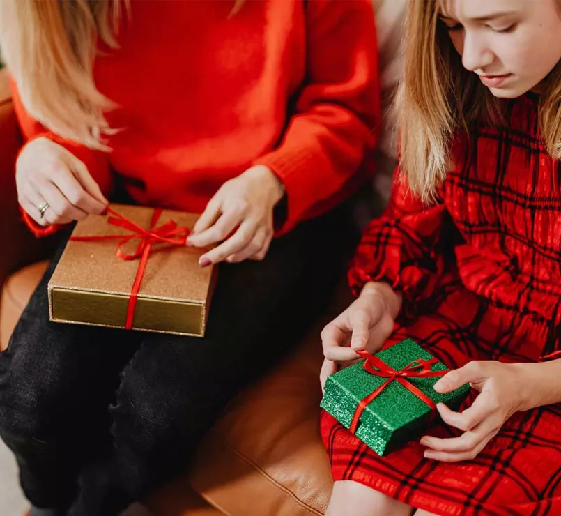 youth opening holiday gifts | Corporate Partners supporting Covenant House this holiday season
