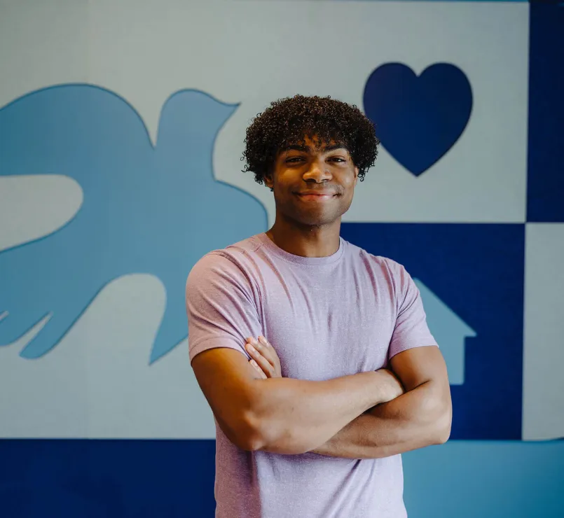 Young man smiling for the camera at Covenant House