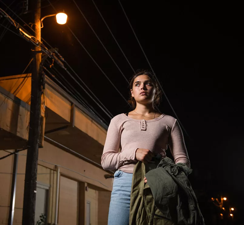 Homeless youth walking alone at night